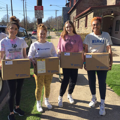 Anthony, Cordrey, Pardee and Dyer (from left) haul boxes at Christ Episcopal Church.