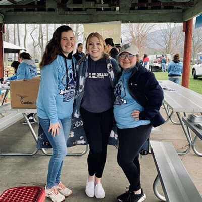 Students (from left) Wiest, Flanagan and Stauffer have fun working registration.