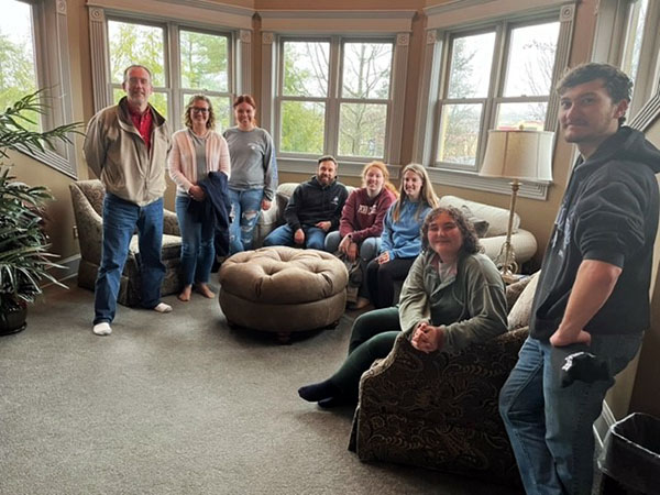 Wozniak stands at left with Oberlin and Ritter, part of the Women in Construction contingent on The Victorian House tour. Others include Witmer, the active student organization's president (seated, in blue).