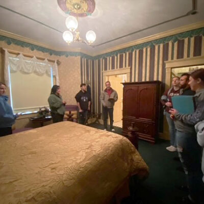 The tour stops in one of the building's four bedrooms, inspired by Williamsport's rich lumber-era heritage.