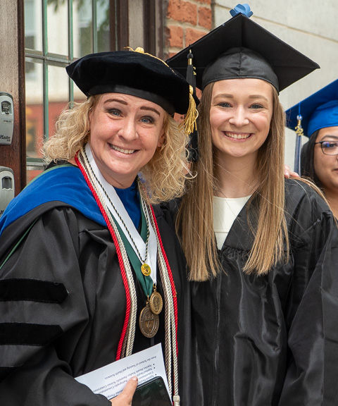 Tina M. Evans (left), associate professor of applied health studies, makes a memory with Caitlin M. DeLosa, health science. 