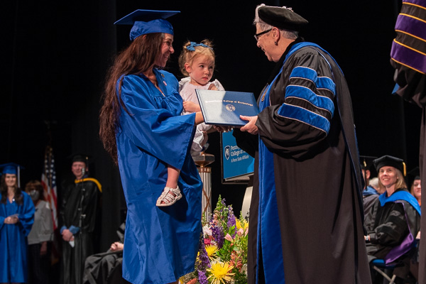 The recipient of the Dr. Clarke J. Hollister Award in dental hygiene, Samantha S. Theriault adorably observes 