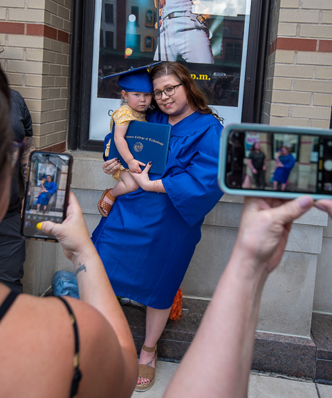 Nursing graduate McKenzy S. Burley and daughter prove to be popular photo subjects.