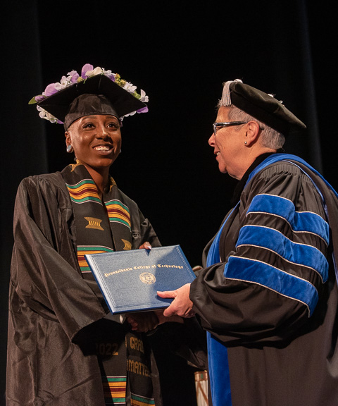A faceful of happiness – Janice Hyacinth Strachan – easily attracts the camera's notice. Like her class speaker, she graduated from the four-year welding & fabrication engineering technology major.