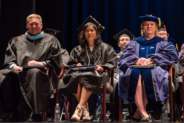 Class representative Ybarra sits between the Stricklands: Elliott and Carolyn R., vice president for enrollment management and associate provost.