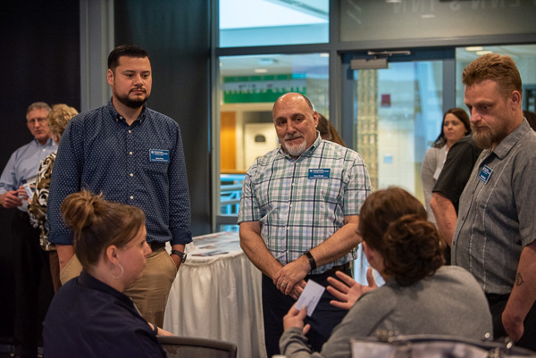 Workforce Development staff were on hand to talk with guests, including (from left): Gerry Pena, SME training specialist; Ross A. Berger, MIDAS grant manager; and Chris D. Gramling, SME training specialist.