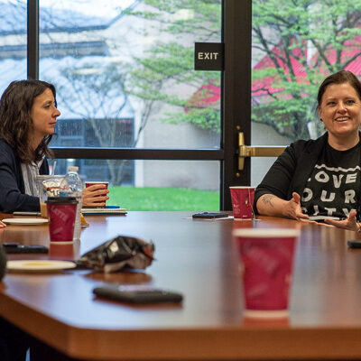 Lake shares personal and professional insights as Jillian T. Scanlon (left), instructor of human services/social science, listens.