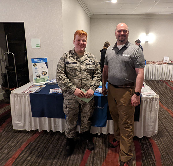 Schlosser meets with a CAP member interested in the college's dual paramedic science and emergency management & homeland security degree. (Photo provided)