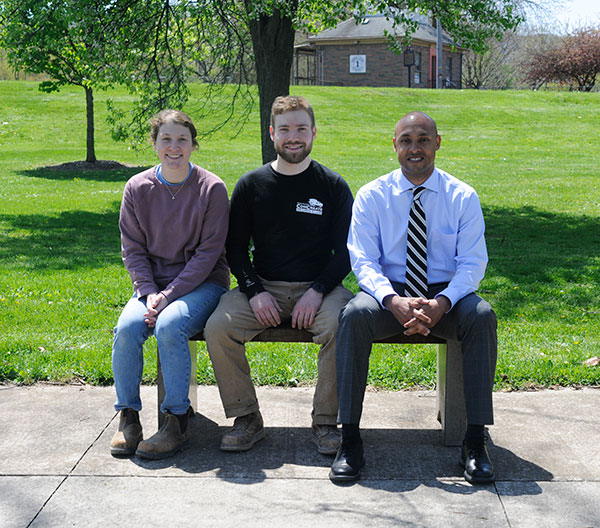Fresh from an April 29 Arbor Day ceremony in another part of the city, Mayor Derek Slaughter joins Madison Kistler and Harrison Wohlfarth in Memorial Park to affirm the project's success.