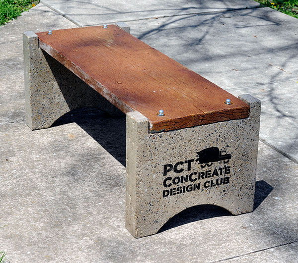 The students used a woodgrain form, but it's definitely concrete – fooling the eye, but extending the benches' outdoor durability.