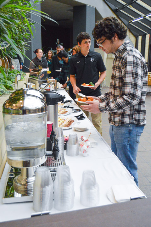 Attendees fill their plates in KDR.