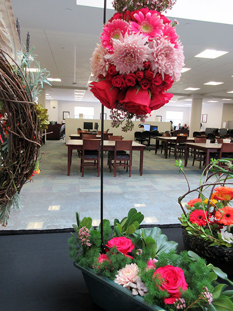 A Biedermeier-styled floral orb rises from the display table, the work of another heavy equipment operations student: Sadie Louise Miller, of Mill Hall.