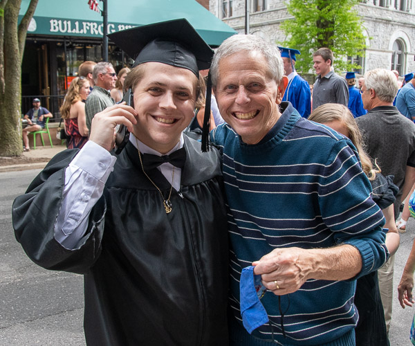 Building science & sustainable design grad Gavin R. Hoffman with his dad, Craig. (Gavin is trying to call instructor Daniel L. Brooks.)