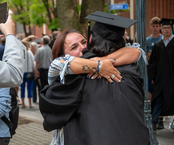 Karla Woods hugs her son, Javier E., of Bloomsburg, who earned a degree in residential construction technology & management.