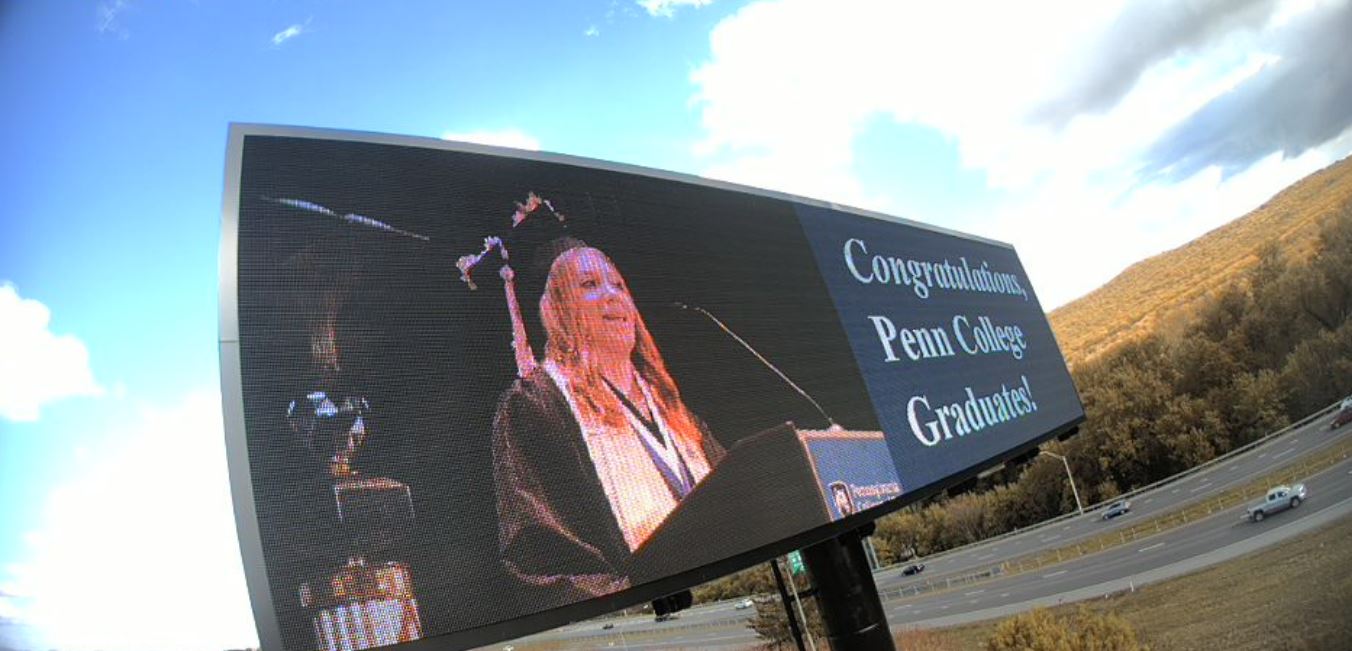 A digital billboard carries an image of Friday's speaker in this webcam photo.