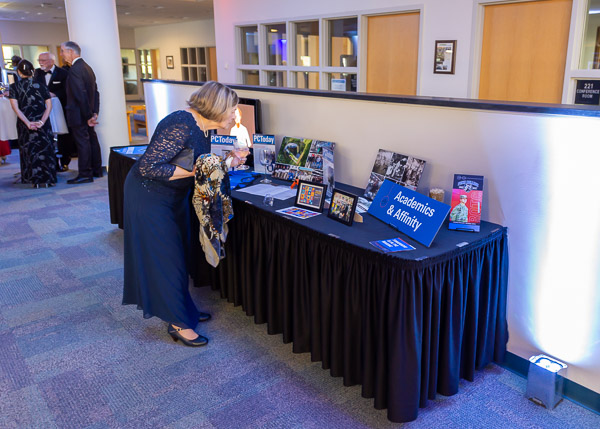 Nancy C. Bowers, a retired member of the mathematics faculty, views an exhibit on 