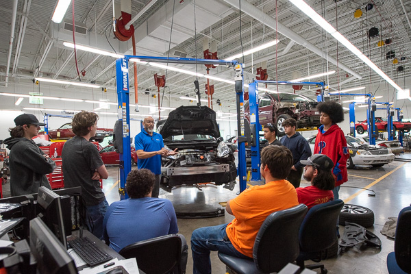 The science behind electric cars is covered by instructor Eric D. Pruden in one of the college’s expansive automotive technology labs. 