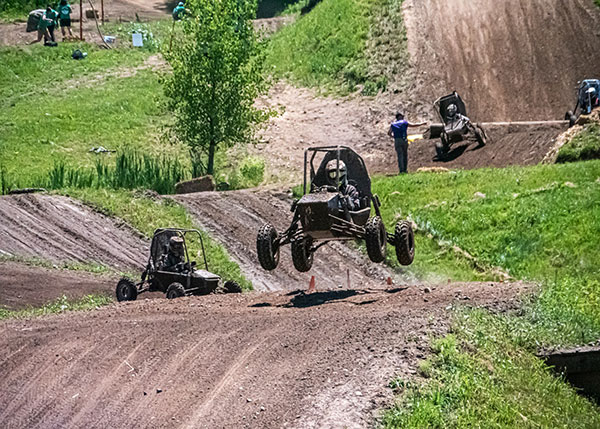 Penn College’s Baja SAE car, driven by Bandle, goes airborne during the rugged endurance race at Baja SAE Rochester. Penn College topped the 77-car field to win the toughest test at Baja SAE competitions.