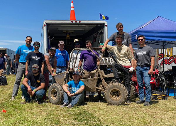 Members of Pennsylvania College of Technology’s Baja SAE team bask in victory after winning the four-hour endurance race at Baja SAE Rochester. Three weeks earlier, Penn College captured the same event at Baja SAE Tennessee Tech. From left are: Dhruv Singh, Dominic J. Lepri, Isaac H. Thollot (crouching), Alex E. Flores, faculty adviser John G. Upcraft, Caleb J. Harvey, Marshall W. Fowler (sitting), Arjun L. Kempe, Morgan R. Bagenstose, Tyler J. Bandle (standing on back of the car), Dakota C. Harrison and Alec D. Rees.