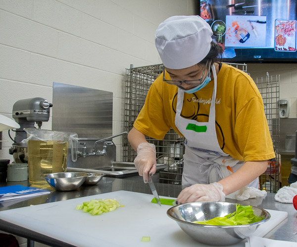 Step 1: chopping vegetables for an eventual Italian feast for the campers’ families in Le Jeune Chef Restaurant. 