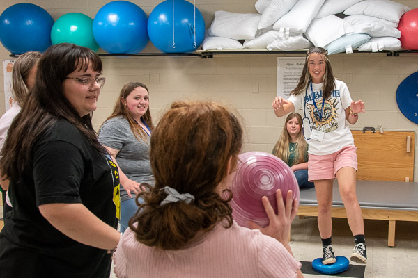 Participants check their balance in the Physical Therapist Assistant Lab.