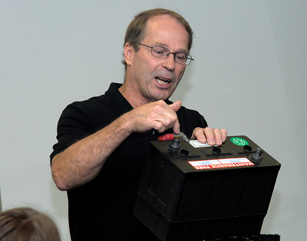During an electrical safety session, diesel equipment technology instructor Bill J. Bashista Jr. discusses precautions when working with automotive batteries ...