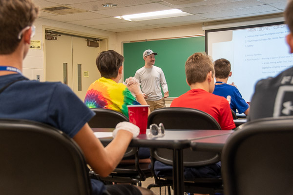 Harrison Wohlfarth, who completed a degree in building construction technology and is pursuing two more – in concrete science technology and applied technology studies – talks with participants about the wide uses of concrete.