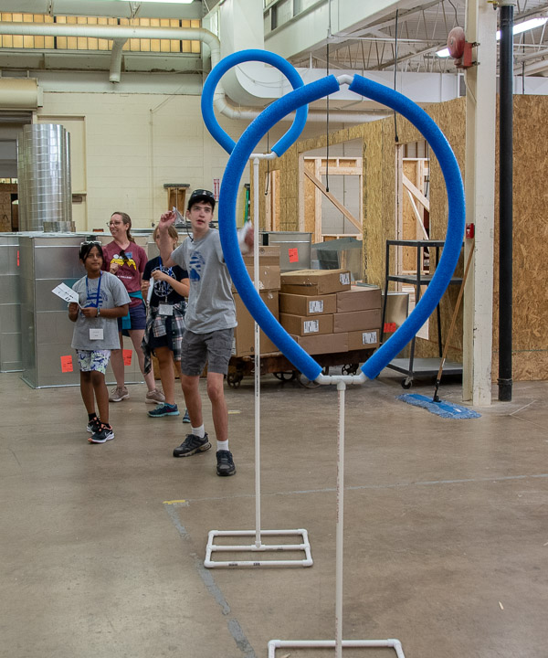 An obstacle course is set up in the Carl Building Technologies Center to experiment with paper airplanes.
