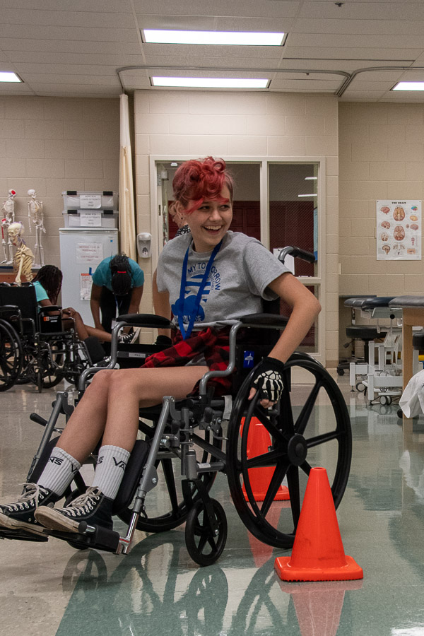 A camper deftly maneuvers obstacles in the Physical Therapist Assistant Lab.