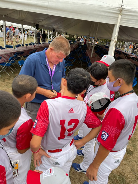 Former major-leaguer Tom O'Malley, a Montoursville native, signs autographs for players from Takarazuka, Japan. O’Malley was the regular season MVP in Japan in 1995 and the Japan Series MVP that year as his team, the Yakult Swallows, won the championship. 