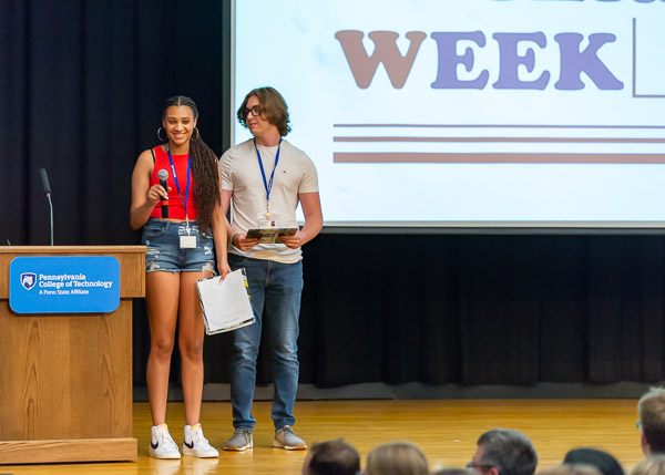 President Reed is introduced by two of the week's company CEOs: Corrin Johnson (left) and Lirik Carson.