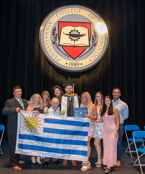 Rolling out the Uruguay flag, the Bilbao family enjoys their moment in the sun – under the seal (complete with a sunflower, his late grandmother’s favorite flower, held by his grandfather). In a commencement address heavily reflective of his relatives' hard work and sacrifice, Bilbao frequently invoked the conscience of his grandmother – his beloved nonna – who told him, 