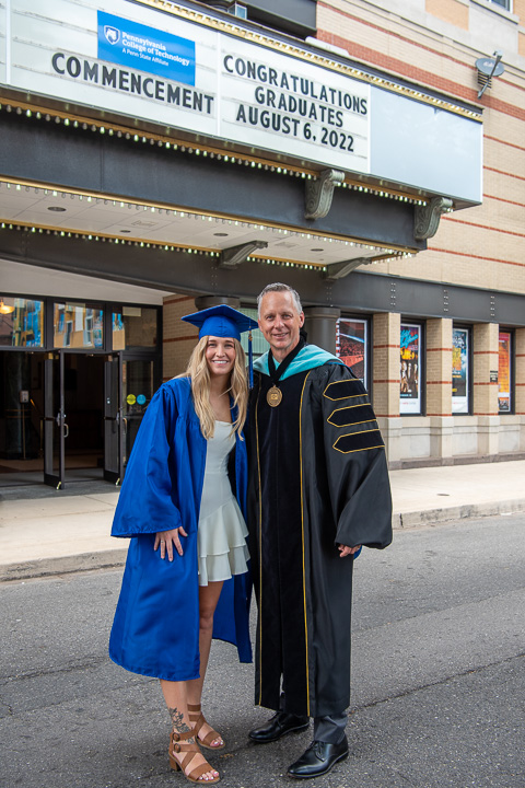 As the crowd dwindles outside, the new president takes one final photo with a lucky graduate: Samantha Marie Davenport, radiography. Congratulations, all!
