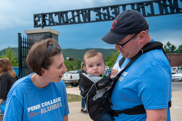 One of the newest Wildcats! The Yoders – Sarah R., coordinator of admissions operations, and Adam J., an industrial training specialist with Workforce Development – enjoy the outing with their son. 
