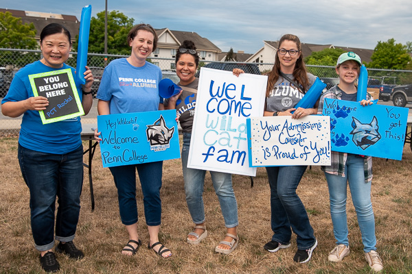 Admissions staff rolls out the welcome wagon. From left are Maya Tsai, Sarah R. Yoder, Andrea R. Schredl, and Stephanie A. Golder and daughter.