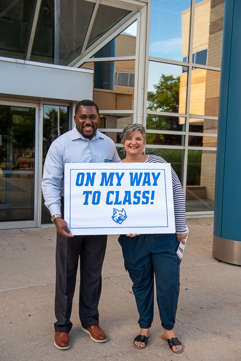 Class acts greet students at the front of the Breuder Advanced Technology & Health Sciences Center: Woods and Tanya Berfield, director of K-12 outreach.