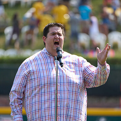 ... with a voice that traveled "o'er the ramparts" and into an appreciative crowd at the LLBWS' final game.
