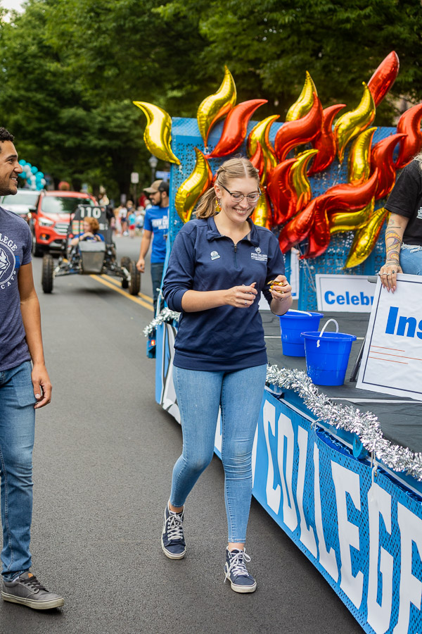 Human services & restorative justice students Jorden K. Graham (left) and Sydney M. Telesky, of Milton, who also serves as Student Government Association president for 2022-23, show their Penn College Pride alongside the parade float.