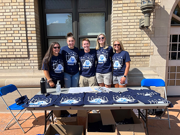 Staffing the T-shirt giveaway (and modeling the inventory) outside the ACC, the venue for the premiere, are Wildcat softball players (from left) Ivvy R. Morder, Hailey J. DeBrody, Maggie J. Mangene, Alyssa Rusnock and Skyelar K. Splain.
