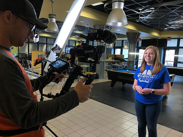 Caila N. Flanagan ’22, shares her Penn College story with Chris Beemer, “The College Tour” director of photography. (Photo by production assistant Rachel Frank, “The College Tour”)