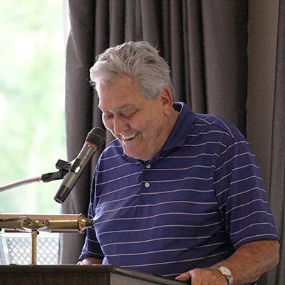 Sleboda welcomes guests, acknowledges sponsors and introduces then-President Davie Jane Gilmour at the 2019 Golf Classic luncheon.