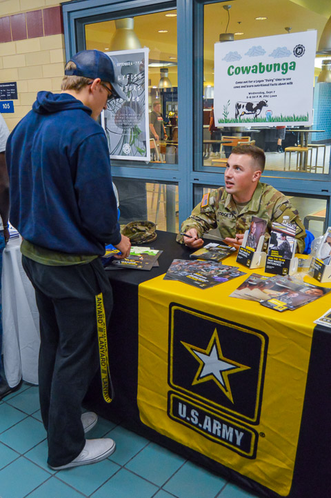 Blake T. Blodgett, commissioned as a second lieutenant in conjunction with his May graduation, talks with a student about opportunities in the Army. Blodgett earned a bachelor's degree in welding & fabrication engineering technology.