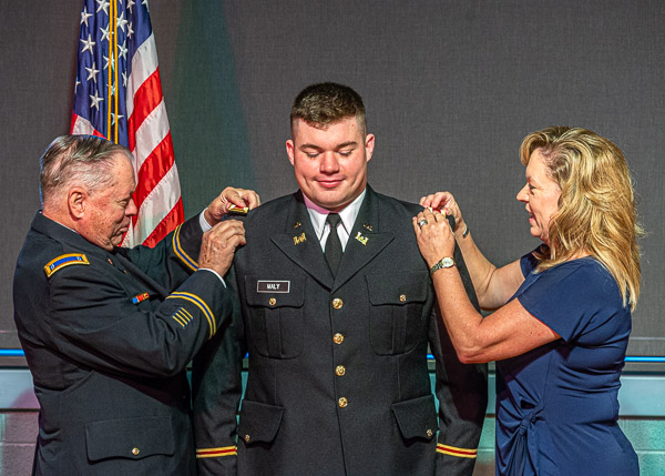 A new second lieutenant gets gold bars from his mother, Deana, and his grandfather, retired Chief Warrant Officer 4 Robert Phillips, an Army veteran of the Vietnam War... 
