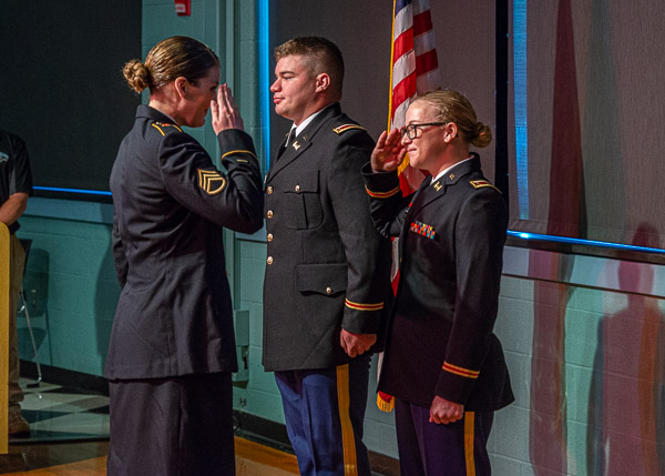 ... and receives her first salute from Staff Sgt. Danielle Fazenbaker.