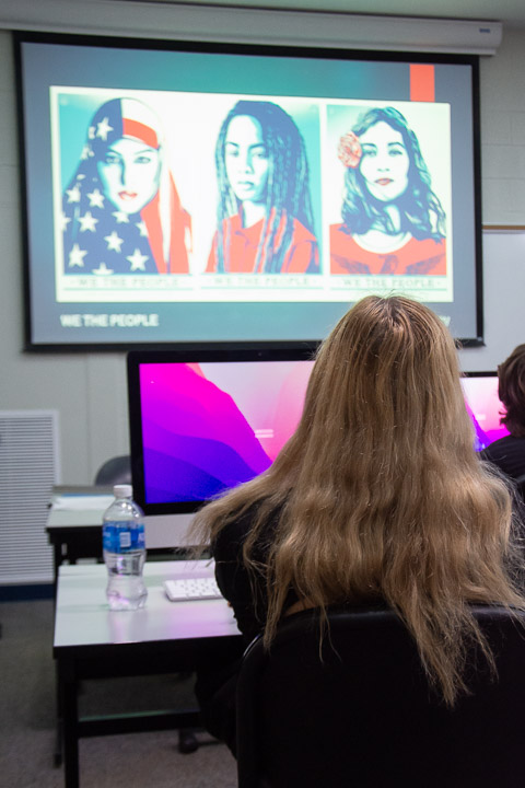 The class reviews examples of artistic expression, from Shepard Fairey's 
