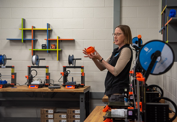 Kat A. Valentine, manager of makerspace operations, introduces visitors to the workshop’s colorful components.
