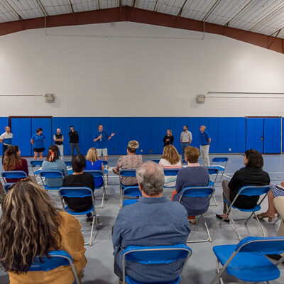 Tyler S. Mensch, men’s soccer coach, talks to the crowd as Athletics coaches and staff took turns introducing themselves.