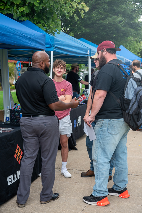 A representative from Ellwood National Forge engages an attentive audience.