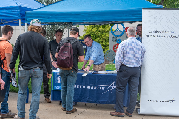 A lineup at Lockheed Martin’s booth