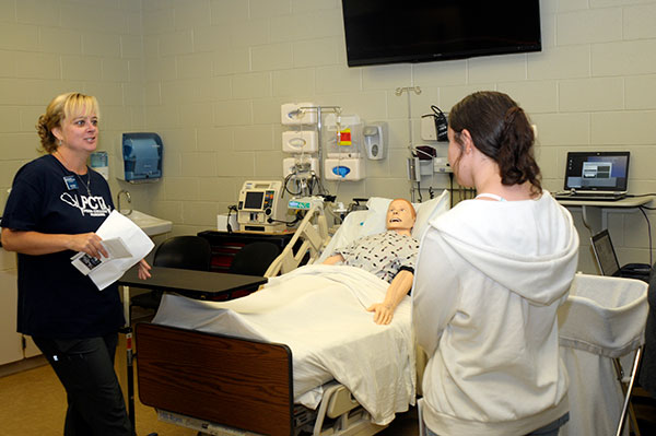 Tara C. Koser, instructor of specialty nursing programs, provides an engaging peek at an ultra-realistic lab – the closest thing to a hospital room, this side of being admitted.
